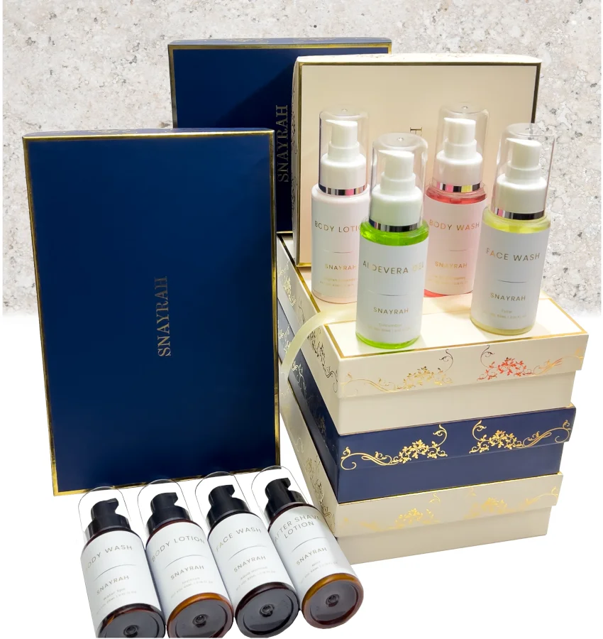 Snayrah brand bulk order image with vertically stacked premium boxes of different sizes and colors for her and him, with one box placed separately for display. All premium boxes and bottles are displayed.