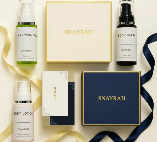 Flatlay of Snayrah gift boxes with skincare bottles and ribbons – Aloe Vera Gel, Body Wash & Body Lotion