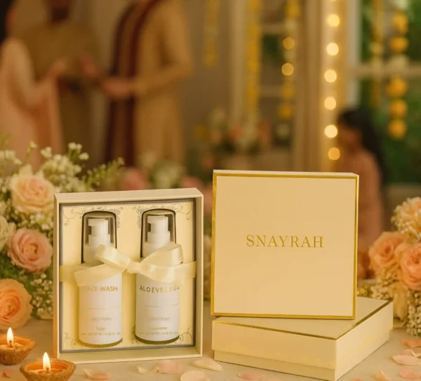 Snayrah gift boxes with skincare bottles and ribbons