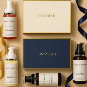 Two skincare gift boxes in cream and royal blue with SNAYRAH logo and ribbon, placed side by side