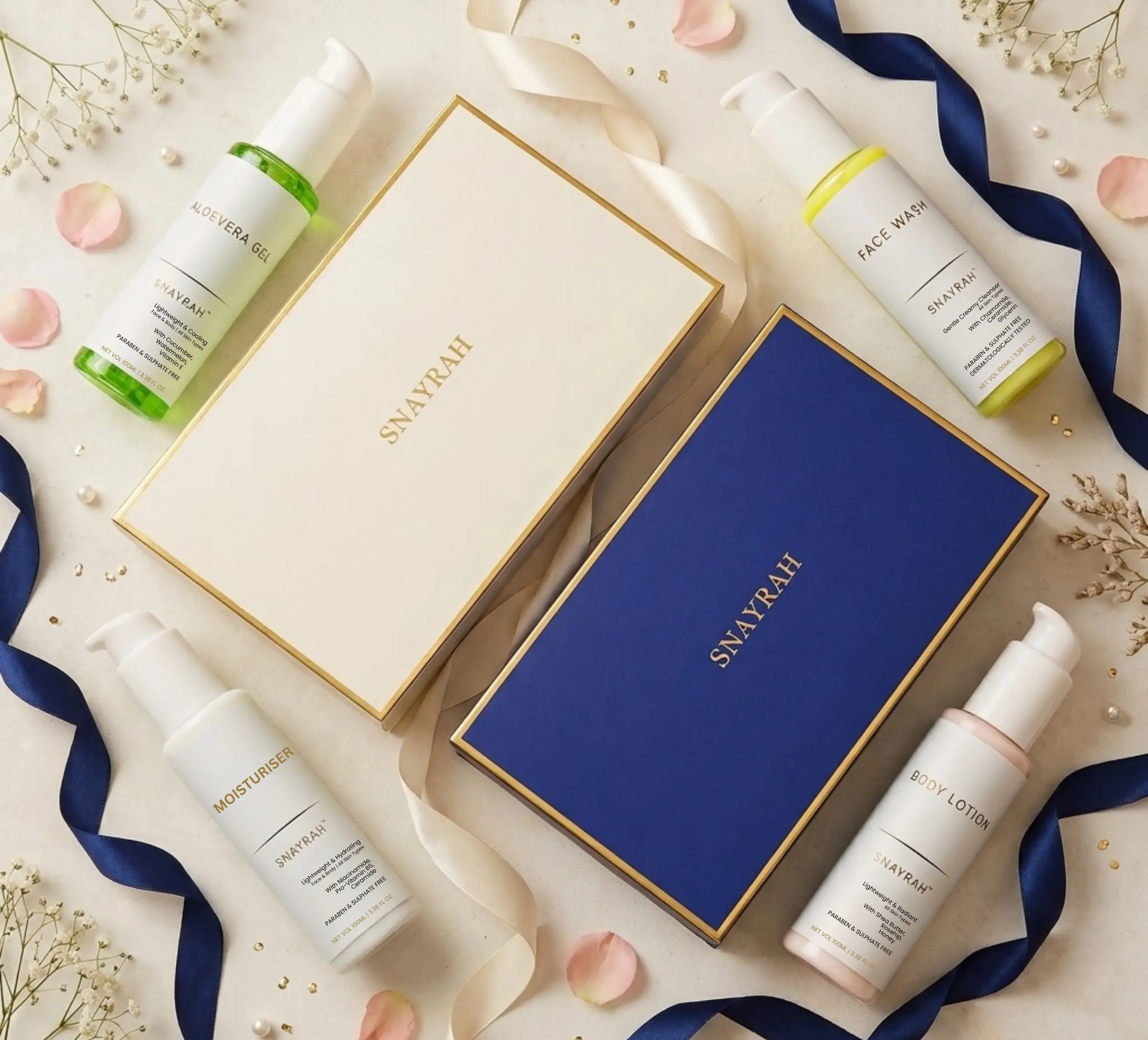 SNAYRAH duo gift set boxes in cream and royal blue with Aloe Vera Gel, Face Wash, Moisturiser and Body Lotion