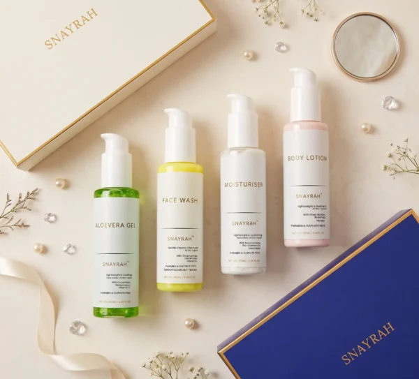 SNAYRAH trio gift set boxes in cream and royal blue with Aloe Vera Gel, Face Wash, Moisturiser and Body Lotion