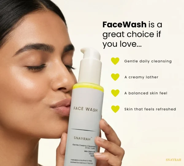 Woman holding SNAYRAH Face Wash with visible benefit points for gentle daily cleansing, a creamy lather, a balanced skin feel and refreshed-looking skin