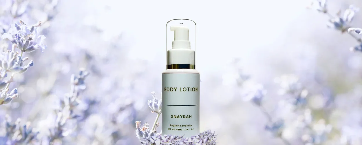 Snayrah Body Lotion for Her with English Lavender fragrance, featuring lavender flowers for illustration.