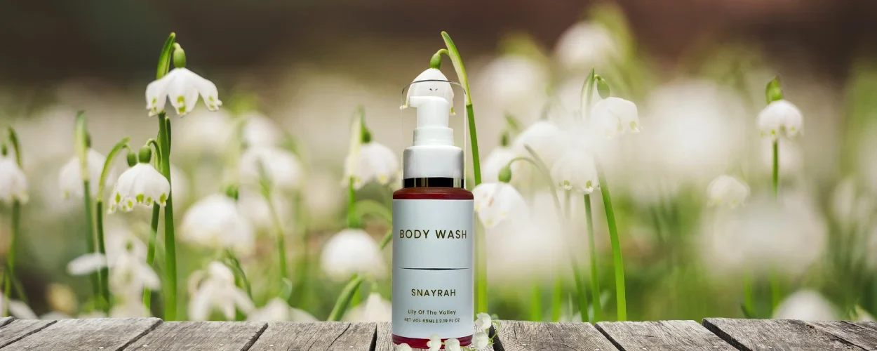 Snayrah Body Wash for Her with Lily of the Valley fragrance, featuring flowers for representation.